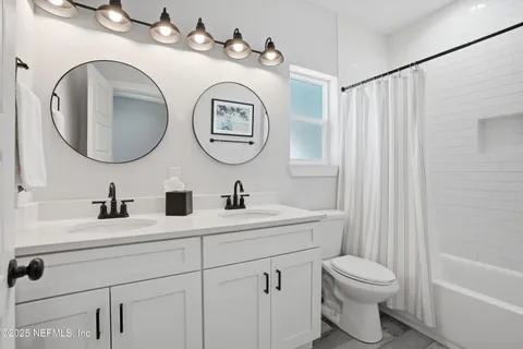 a room with furniture and air conditioner vent