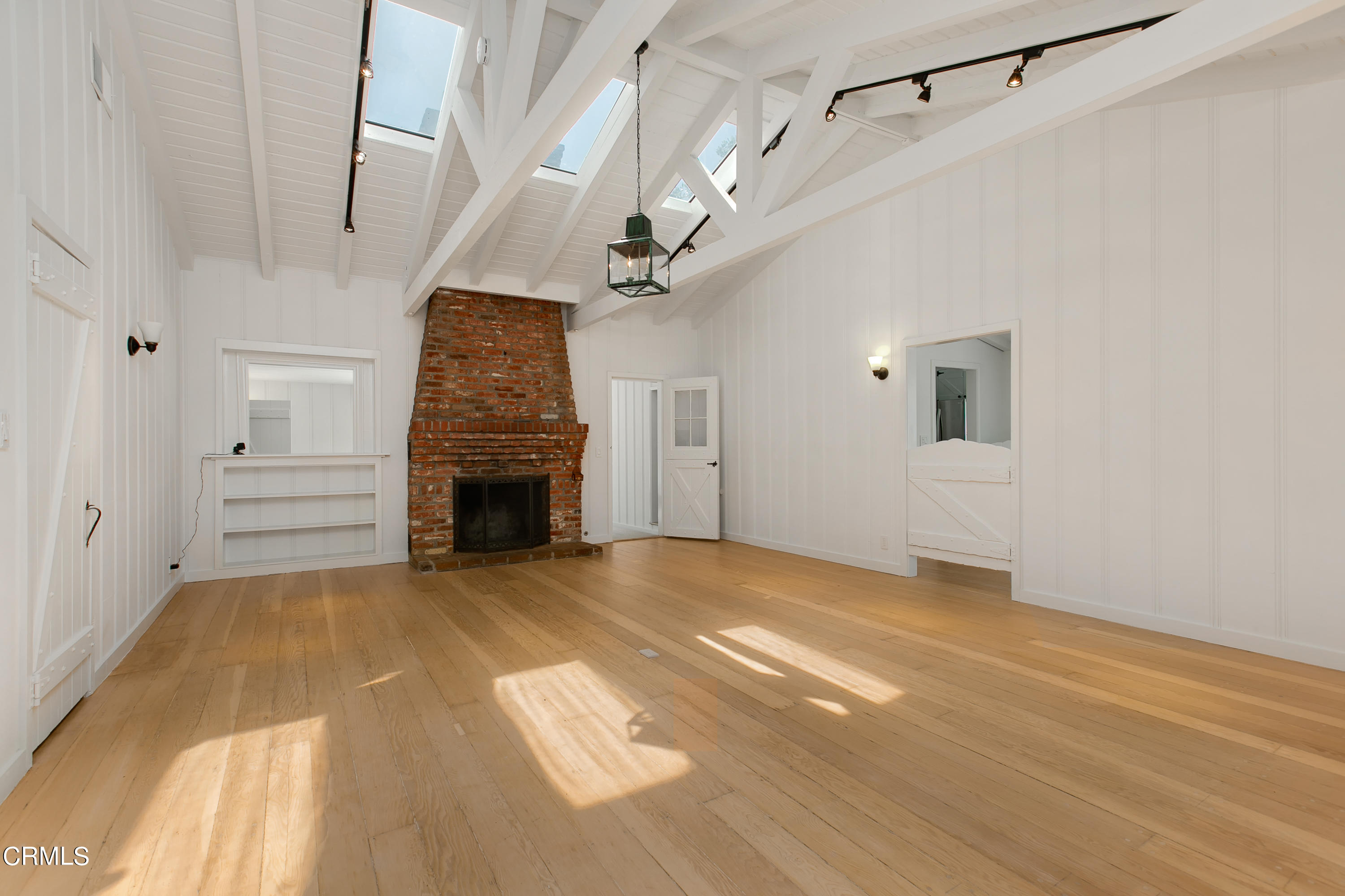 4904 Hampton Road La Canada Flintridge, CA 91011 - Photo 4 of 20 a view of a livingroom with a fireplace a ceiling fan and window