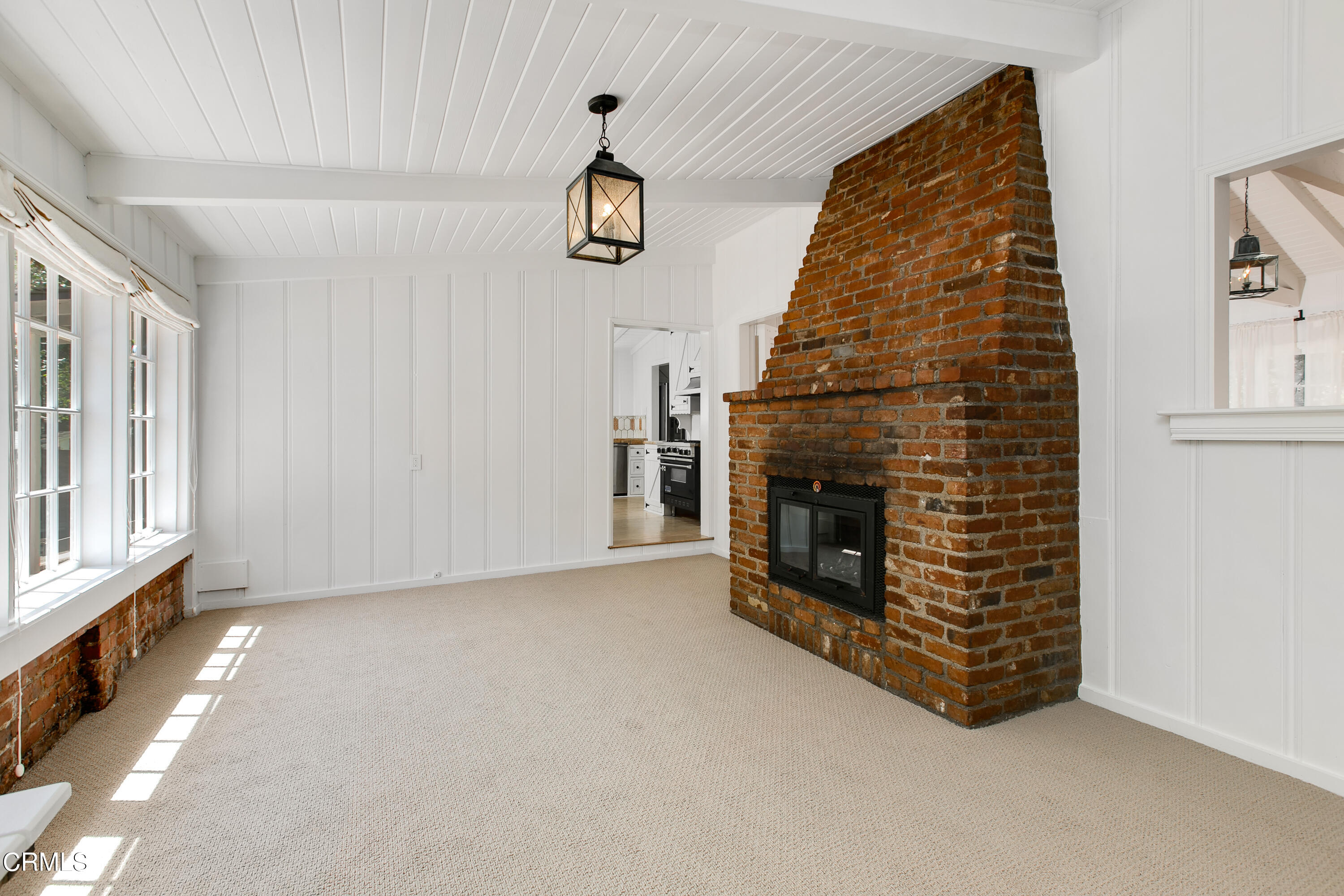 4904 Hampton Road La Canada Flintridge, CA 91011 - Photo 6 of 20 an empty room with windows and fireplace
