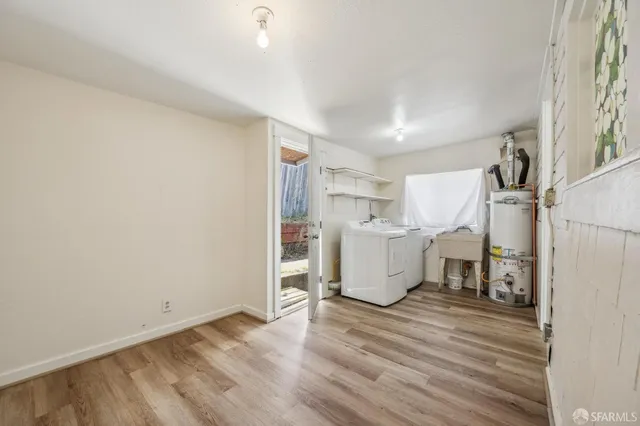 a view of a kitchen with a sink and cabinets