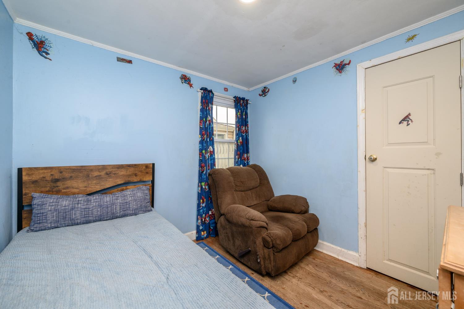 4 Homestead Avenue Avenel, NJ 07001 - Photo 16 of 40 a living room with furniture and a window