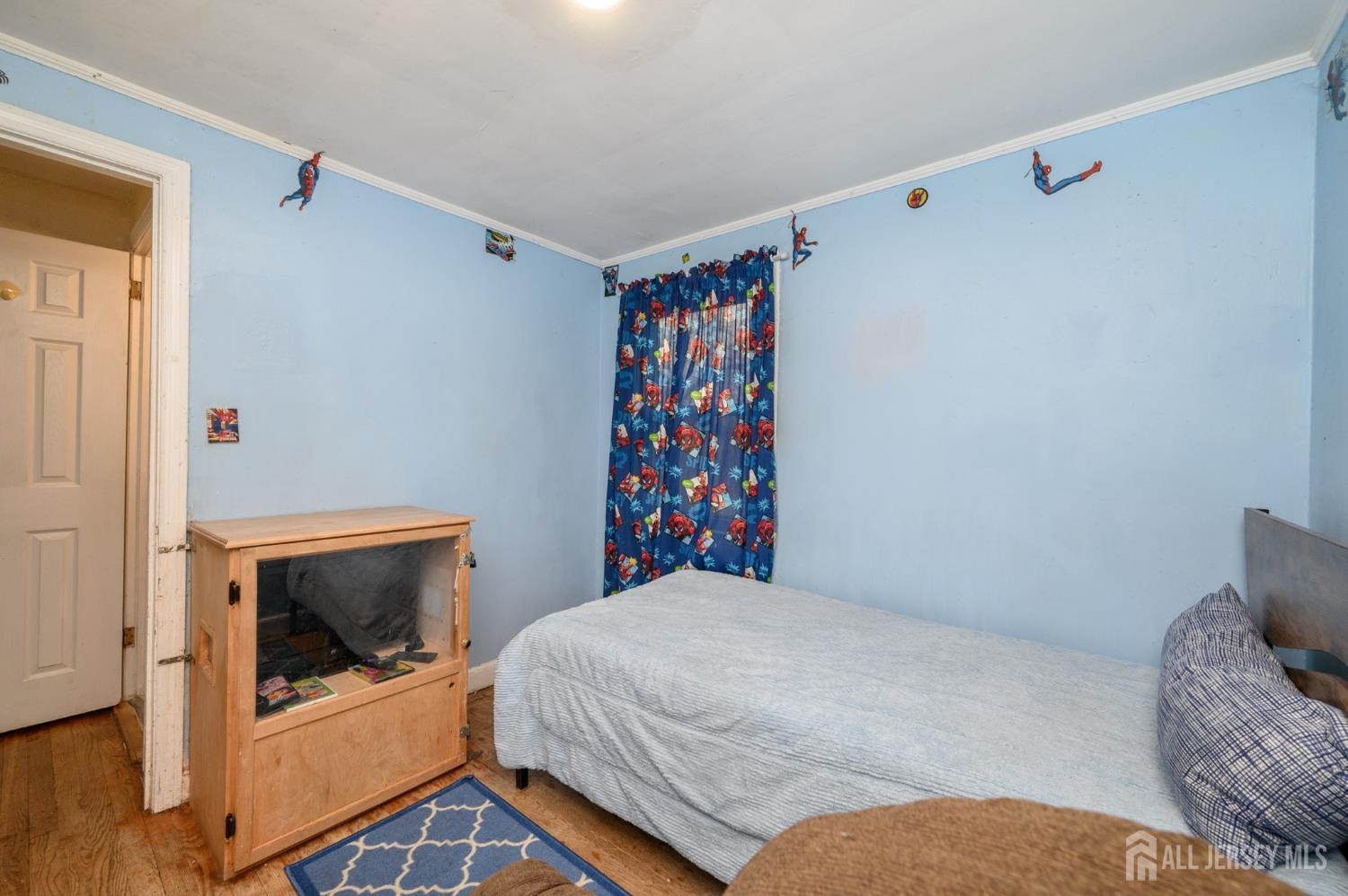 4 Homestead Avenue Avenel, NJ 07001 - Photo 17 of 40 a bedroom with a bed and a fireplace