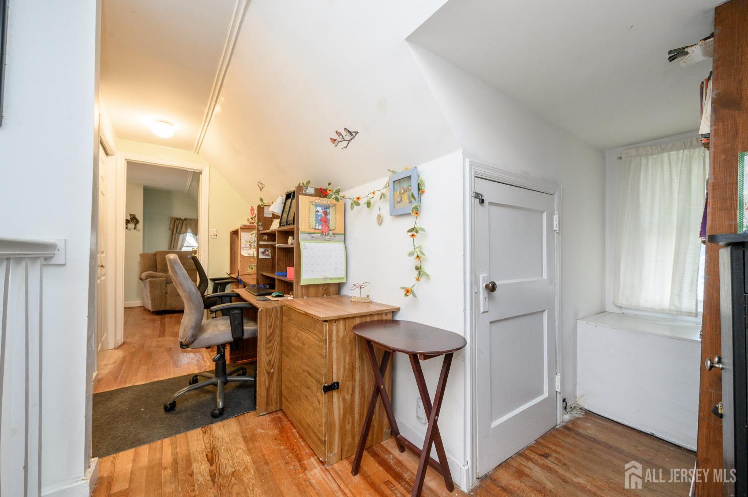 4 Homestead Avenue Avenel, NJ 07001 - Photo 19 of 40 a view of a workspace with furniture and a window