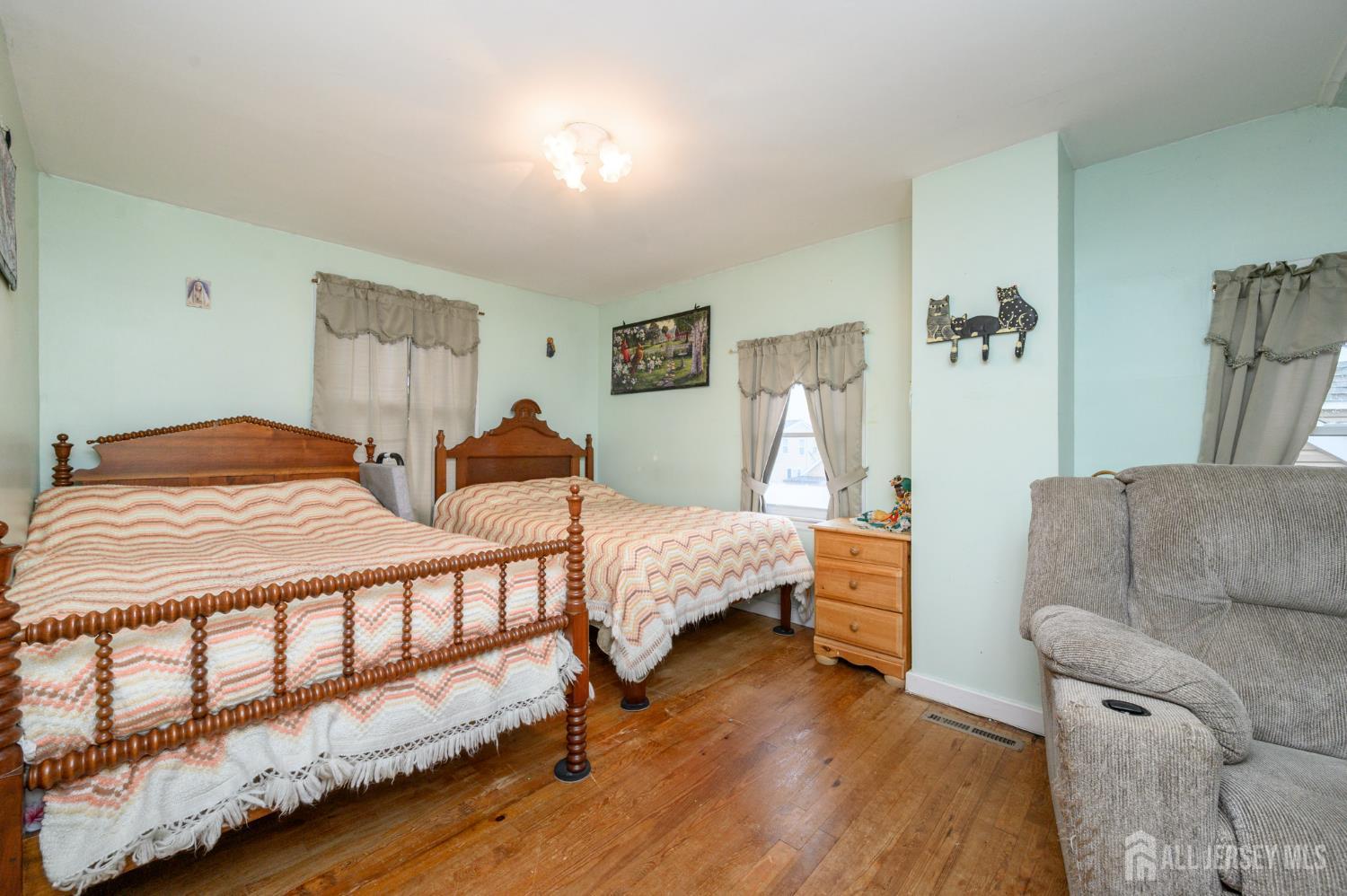 4 Homestead Avenue Avenel, NJ 07001 - Photo 20 of 40 a bedroom with a bed and a couch