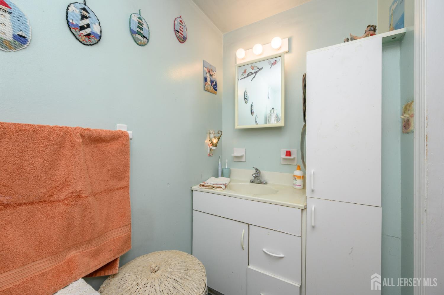4 Homestead Avenue Avenel, NJ 07001 - Photo 23 of 40 a bathroom with a sink a toilet and a shower