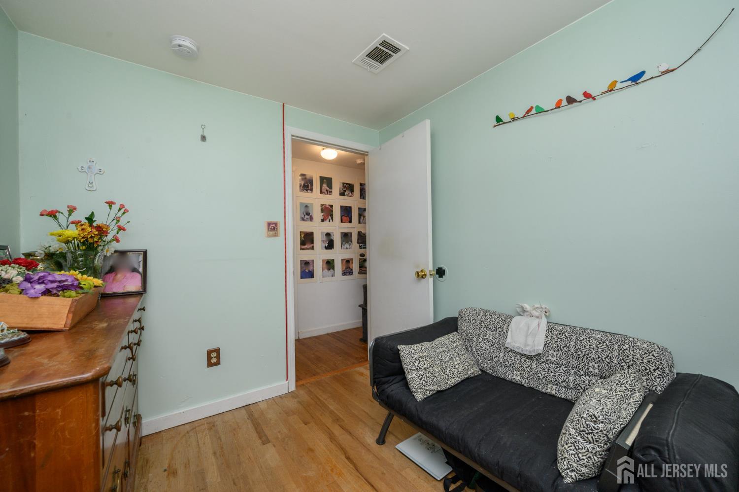 4 Homestead Avenue Avenel, NJ 07001 - Photo 26 of 40 a living room with furniture and flowers