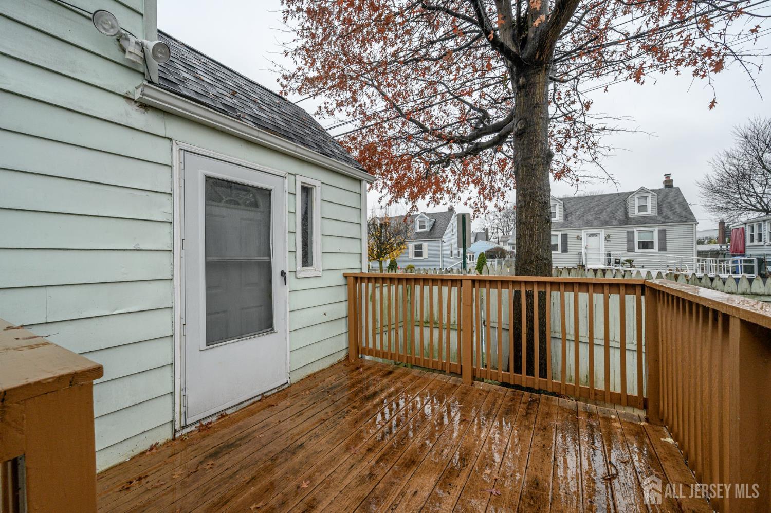 4 Homestead Avenue Avenel, NJ 07001 - Photo 29 of 40 a view of a wooden deck and a yard