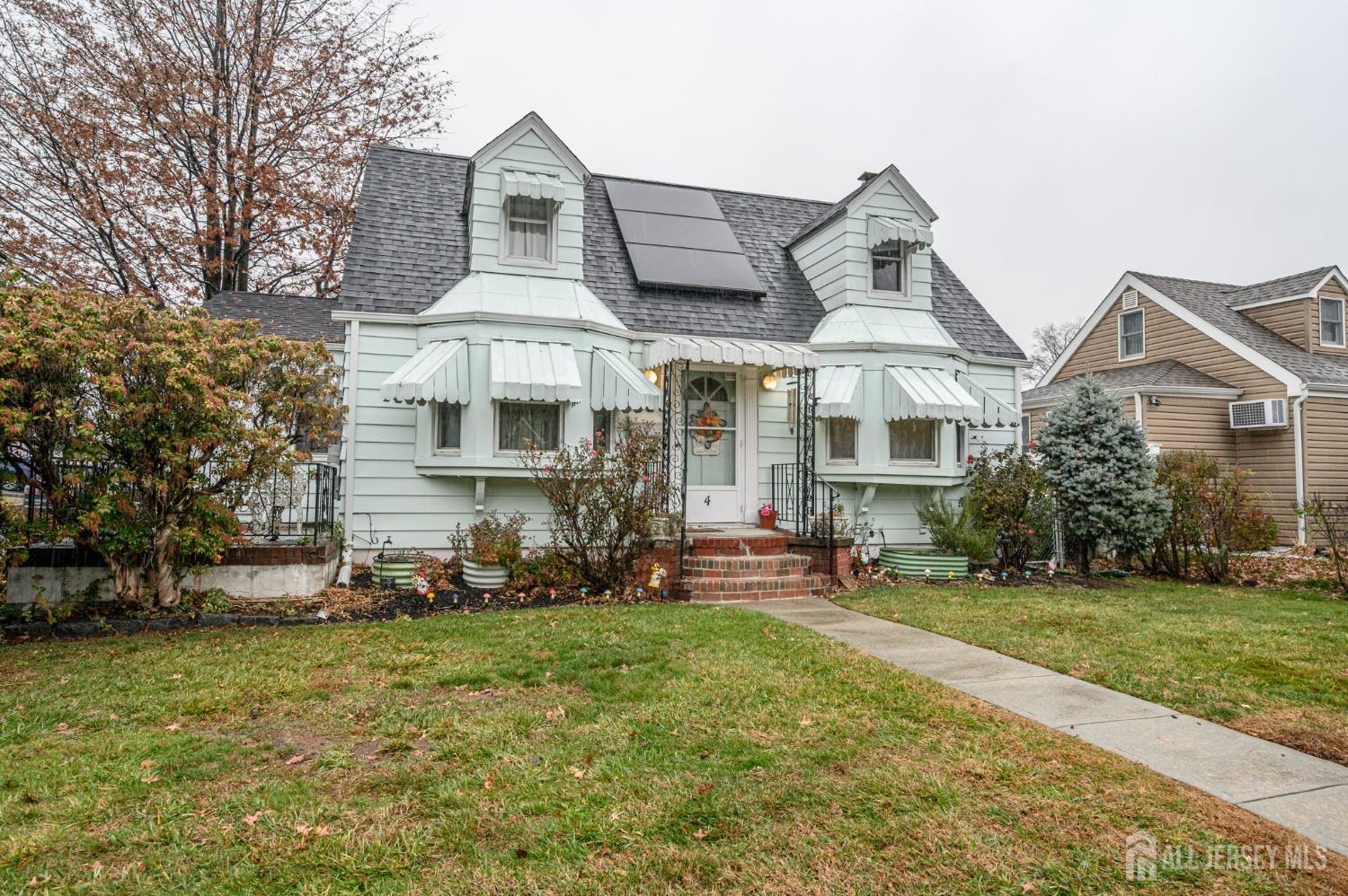 4 Homestead Avenue Avenel, NJ 07001 - Photo 39 of 40 a front view of a house with a yard
