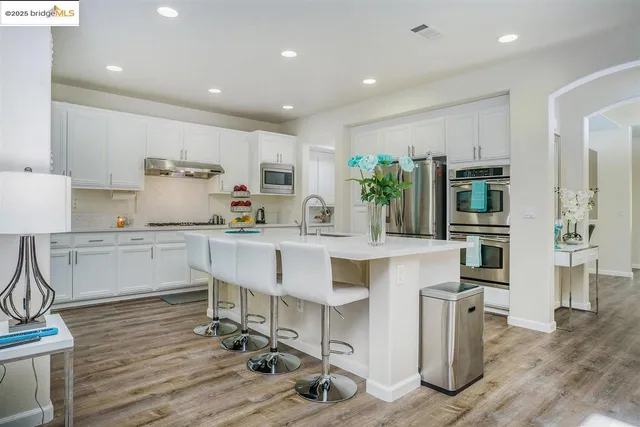 a kitchen with counter space cabinets and appliances