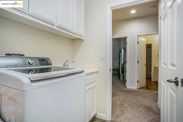 a view of utility room and washer and dryer