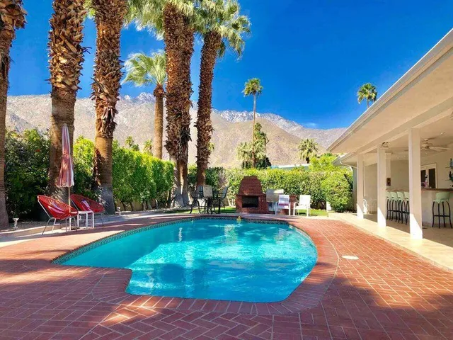 a view of a swimming pool with a patio