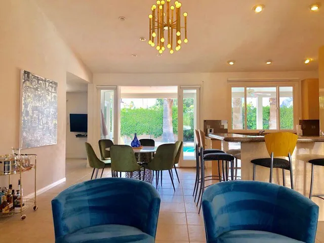 a view of a dining room with furniture window and outside view