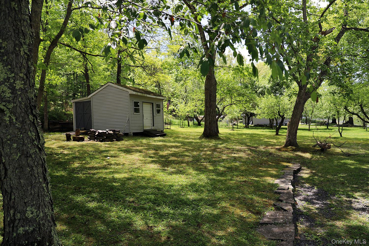 860 River Road Callicoon, NY 12723 - Photo 30 of 45 a view of a garden with a tree