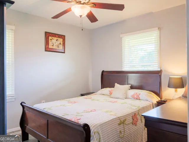 a bathroom with a sink mirror and toilet