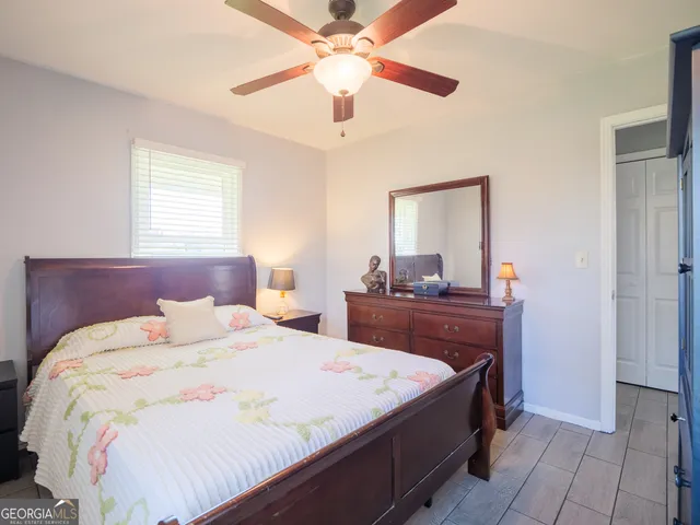 a bedroom with a bed and window