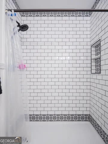 a view of living room filled with furniture and window