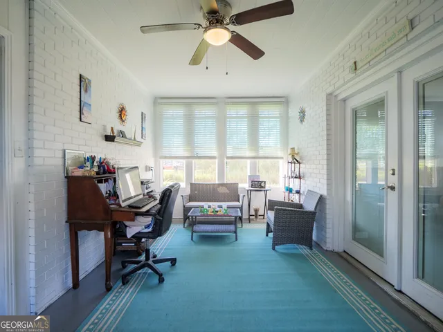 a view of kitchen with furniture and wooden floor