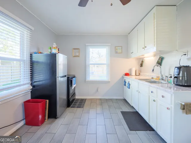 a bathroom with a sink a bathtub and a shower