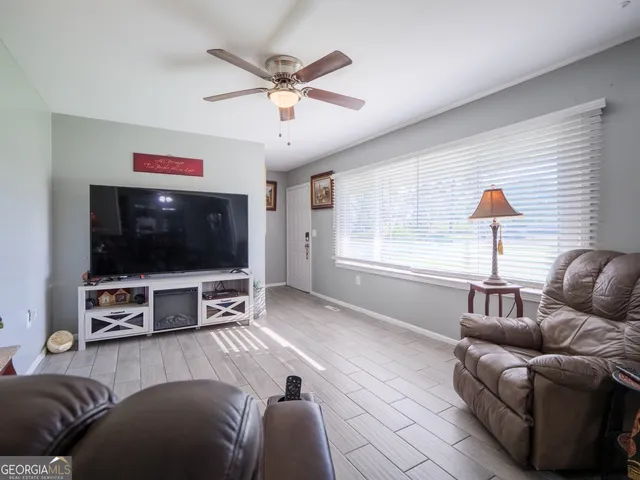 a dining room with furniture and window