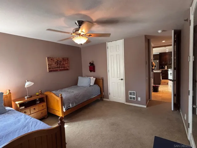 a bedroom with furniture and a chandelier