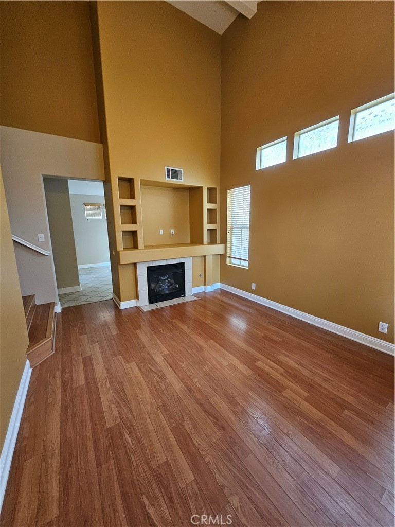 6212 Jasmine Way Cypress, CA 90630 - Photo 2 of 14 a view of empty room with wooden floor and fireplace