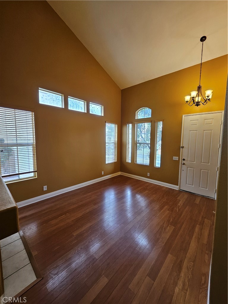 6212 Jasmine Way Cypress, CA 90630 - Photo 3 of 14 a view of an empty room with window and wooden floor