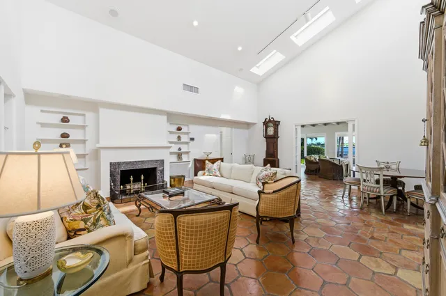 a view of a house with backyard porch and sitting area