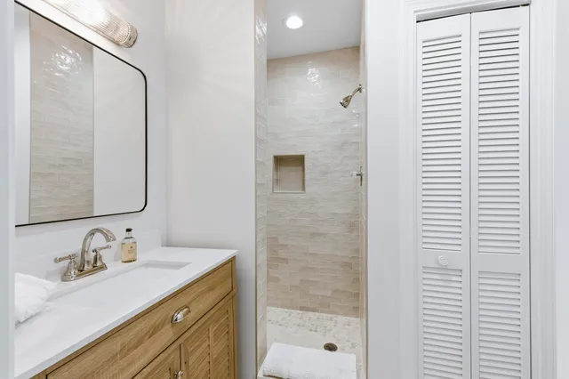 an aerial view of a houses with outdoor space and ocean view