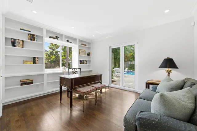 an aerial view of a swimming pool and lounge chairs
