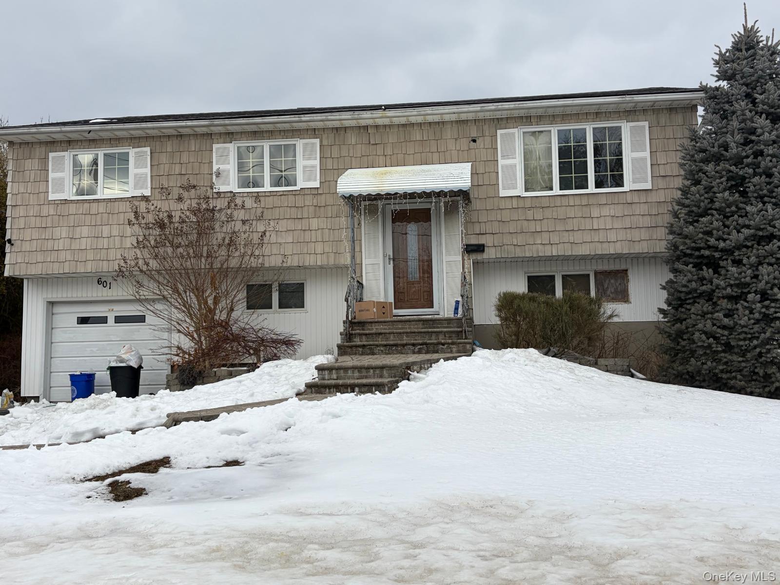 601 Old Country Road Deer Park, NY 11729 - Photo 1 of 1 a front view of a house with a yard