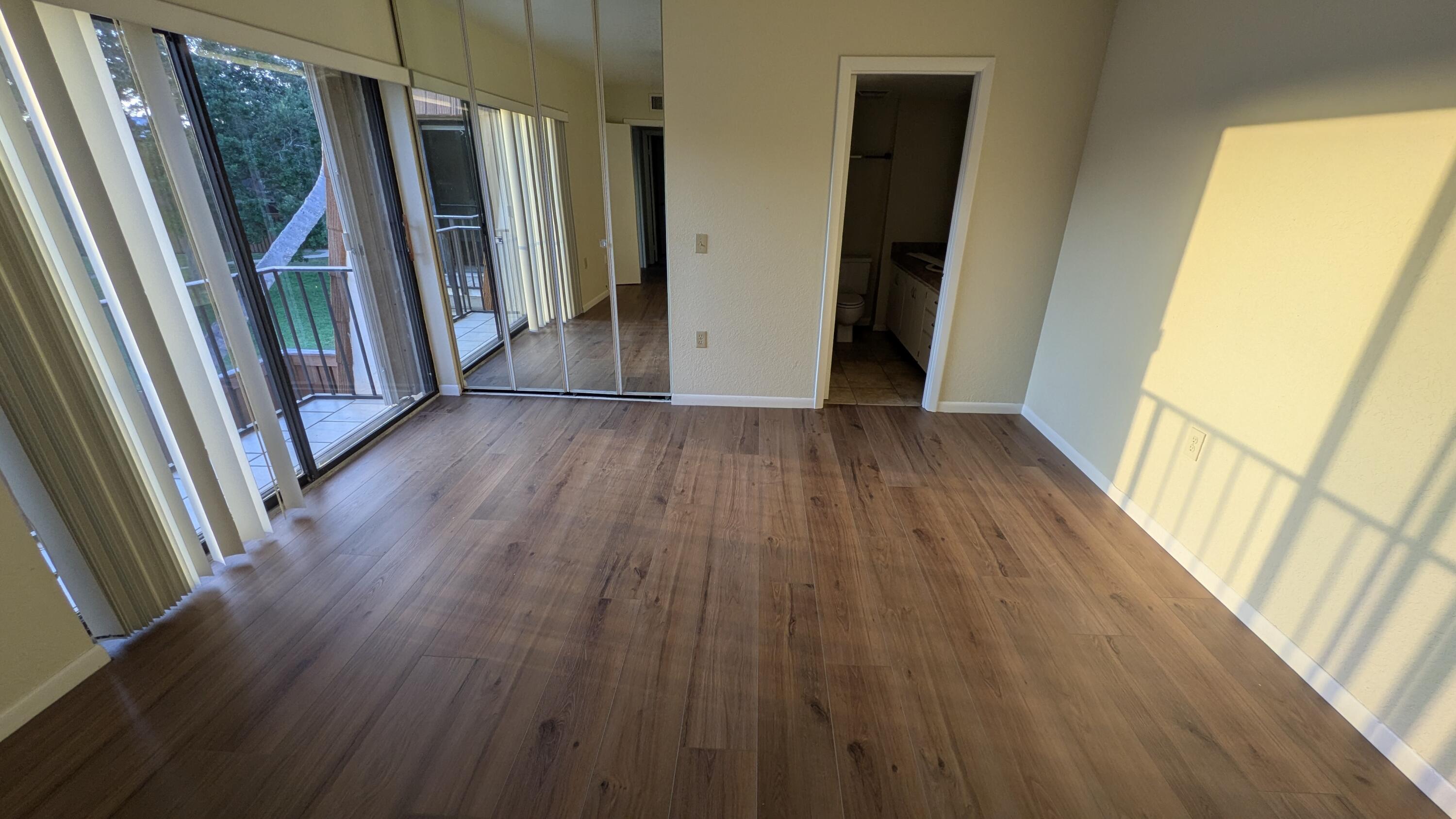 3900 County Line Road, Unit 21D Tequesta, FL 33469 - Photo 17 of 20 a view of front door with wooden floor