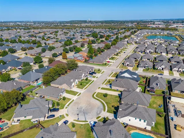 an aerial view of a city with lots of residential buildings