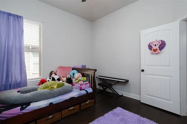 a bed room with furniture and a window
