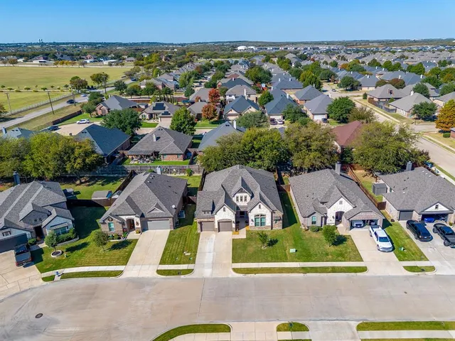 an aerial view of a house with garden