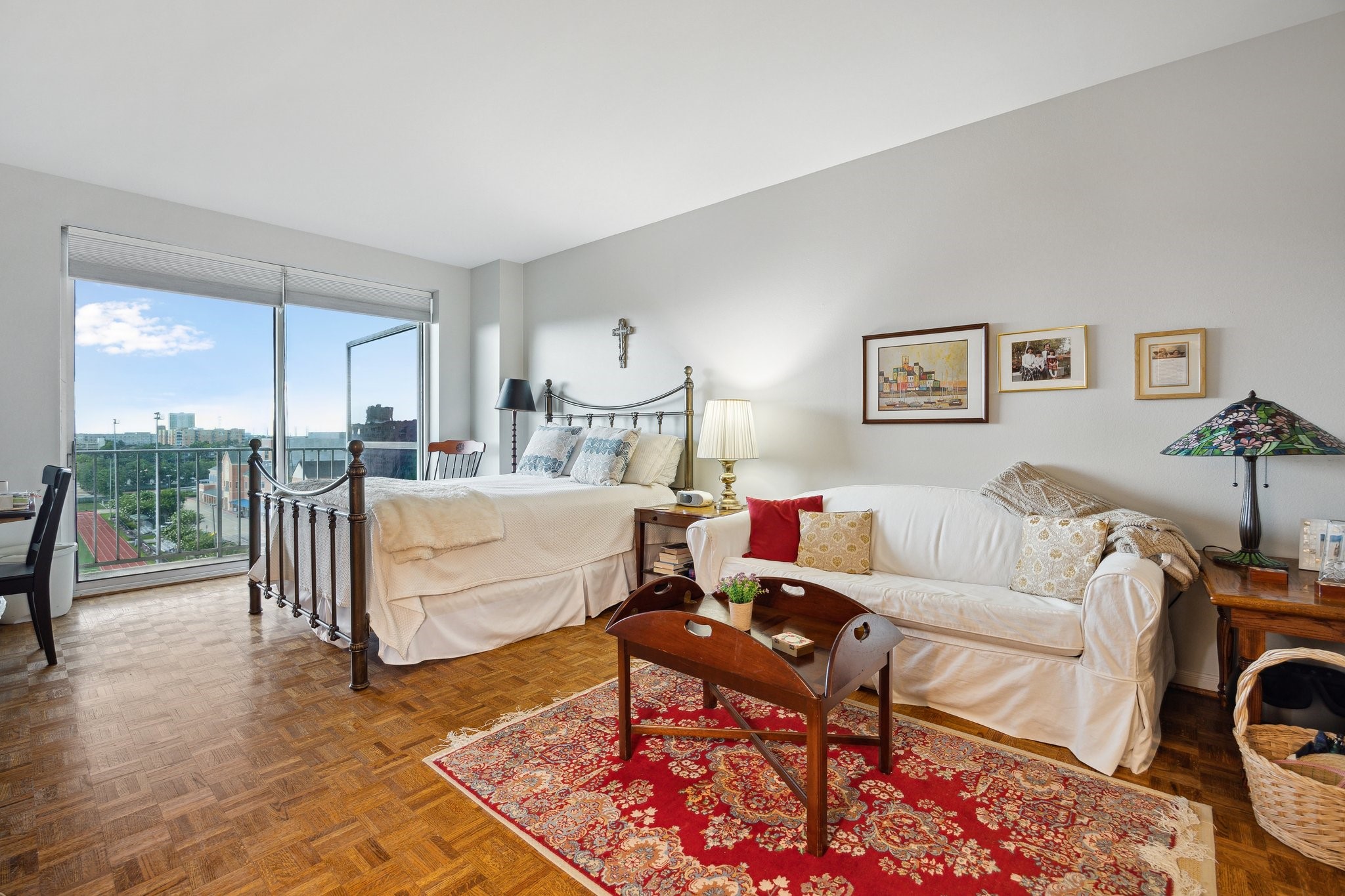 2200 Willowick Road, Unit 7B Houston, TX 77027 - Photo 19 of 32 a living room with furniture a rug and a table
