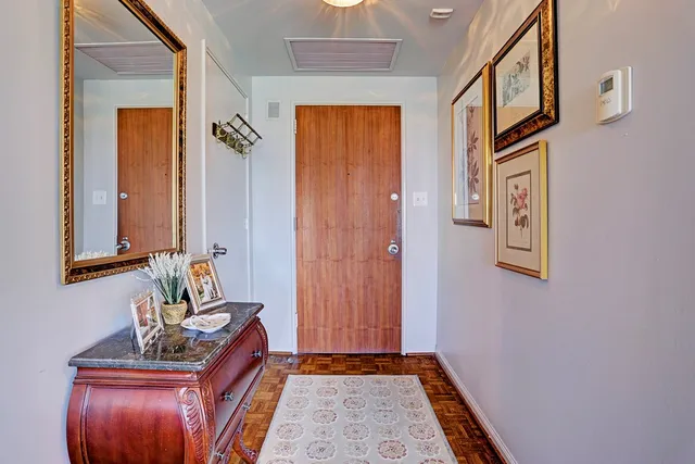 a view of an entryway with wooden floor