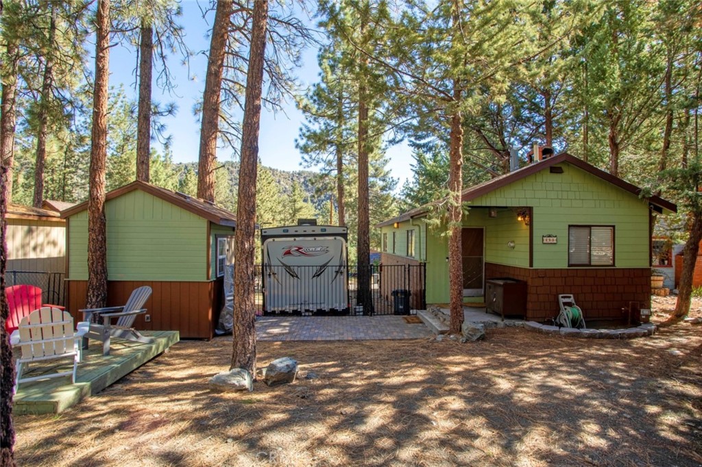 1244 Lark Road Wrightwood, CA 92397 - Photo 1 of 26 a view of a house with backyard and trees