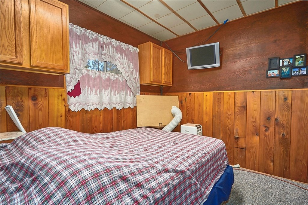 1244 Lark Road Wrightwood, CA 92397 - Photo 20 of 26 a bedroom with a bed and a window