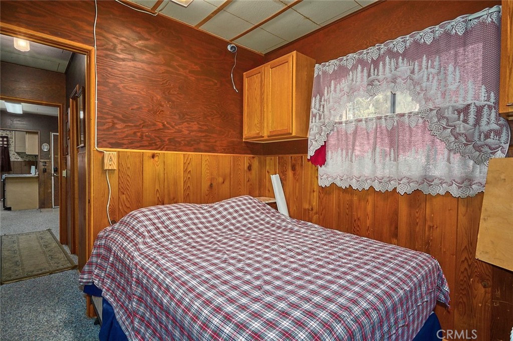 1244 Lark Road Wrightwood, CA 92397 - Photo 21 of 26 a bedroom with a bed and a window