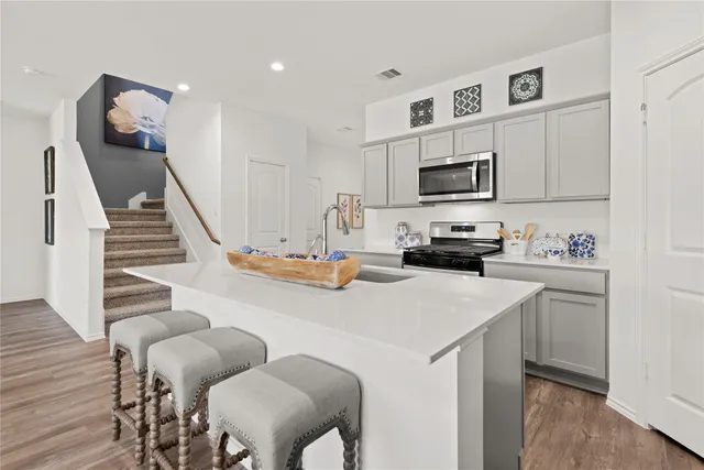 a kitchen with furniture cabinets and a window