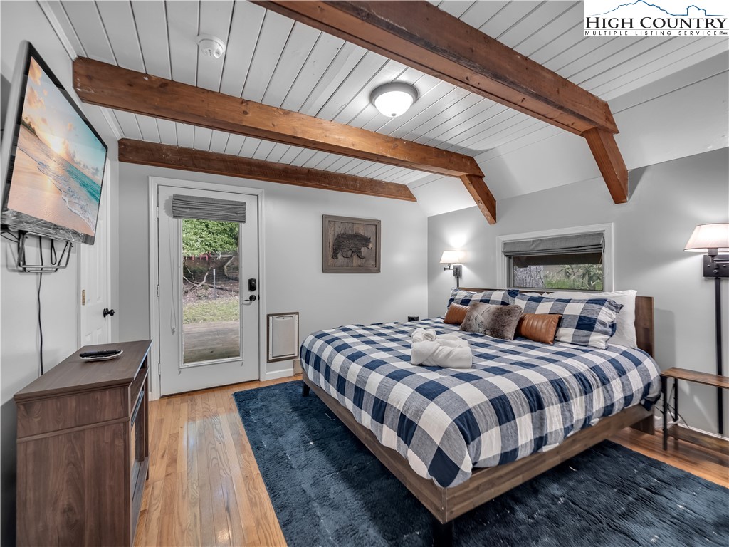 404 Charter Hills Road Beech Mountain, NC 28604 - Photo 11 of 36 a bedroom with bed and a window