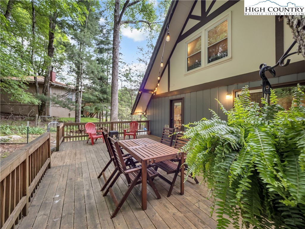 404 Charter Hills Road Beech Mountain, NC 28604 - Photo 16 of 36 a view of a house with backyard and sitting area