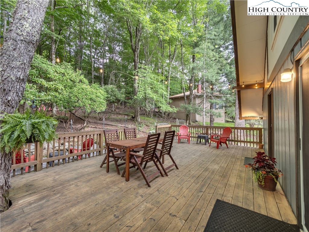 404 Charter Hills Road Beech Mountain, NC 28604 - Photo 18 of 36 a view of a chairs and table in patio