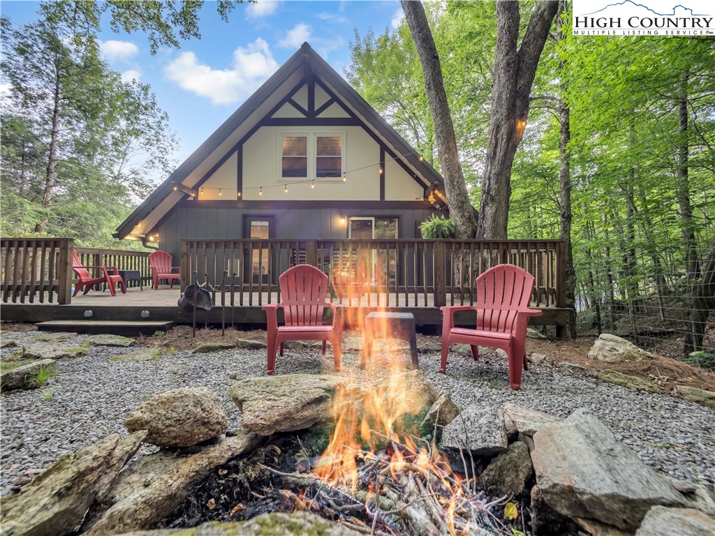 404 Charter Hills Road Beech Mountain, NC 28604 - Photo 19 of 36 a view of a house with backyard and sitting area