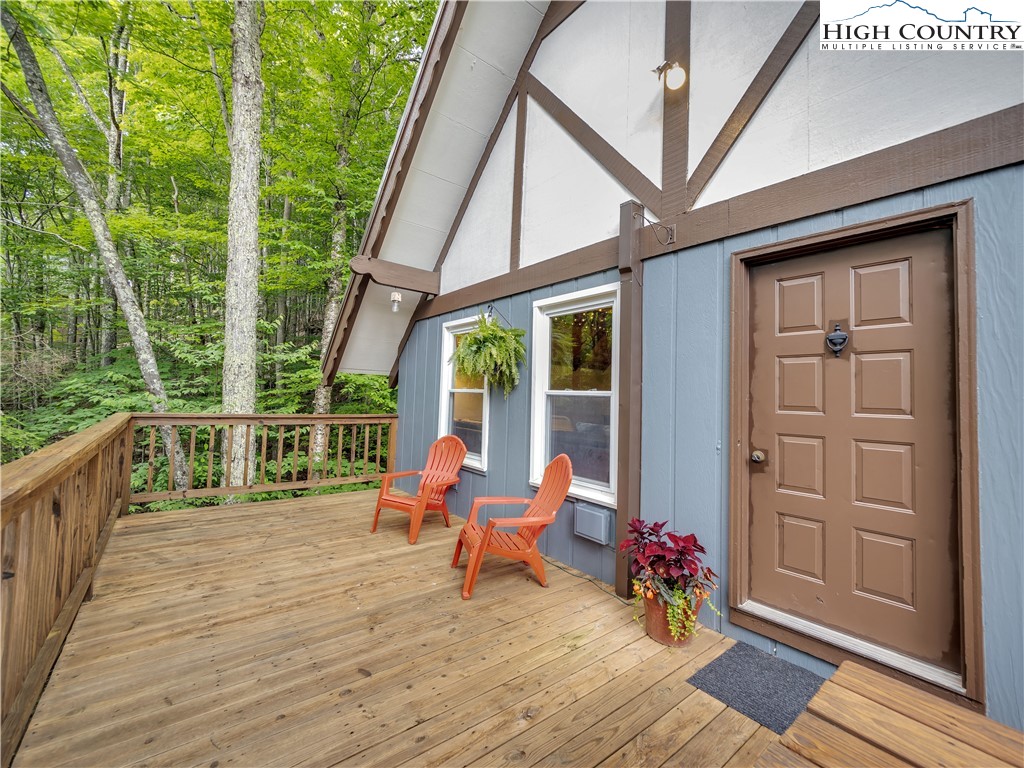 404 Charter Hills Road Beech Mountain, NC 28604 - Photo 2 of 36 a deck view with a seating space