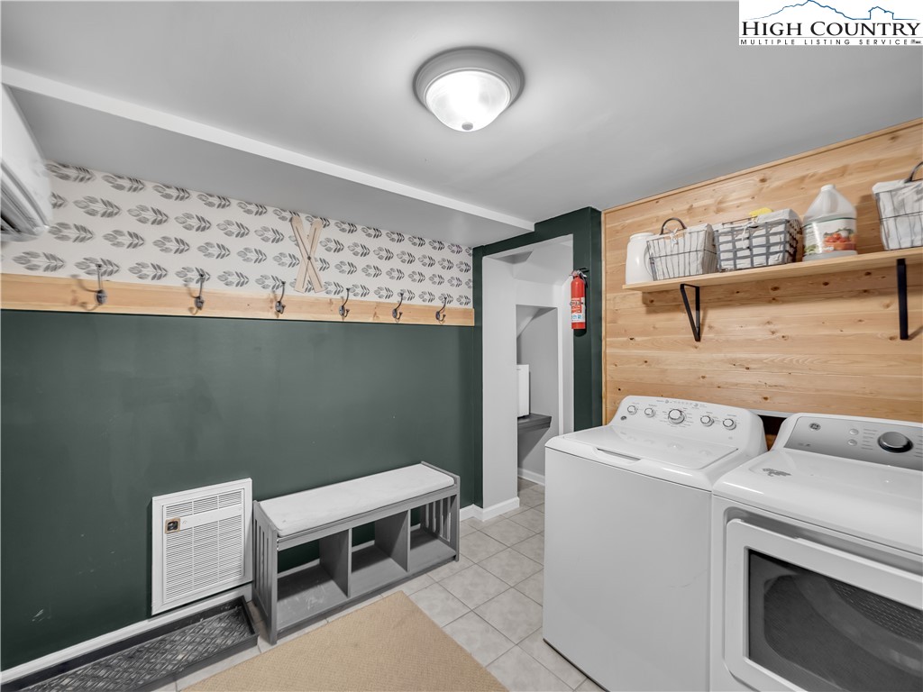404 Charter Hills Road Beech Mountain, NC 28604 - Photo 25 of 36 a utility room with dryer and washer