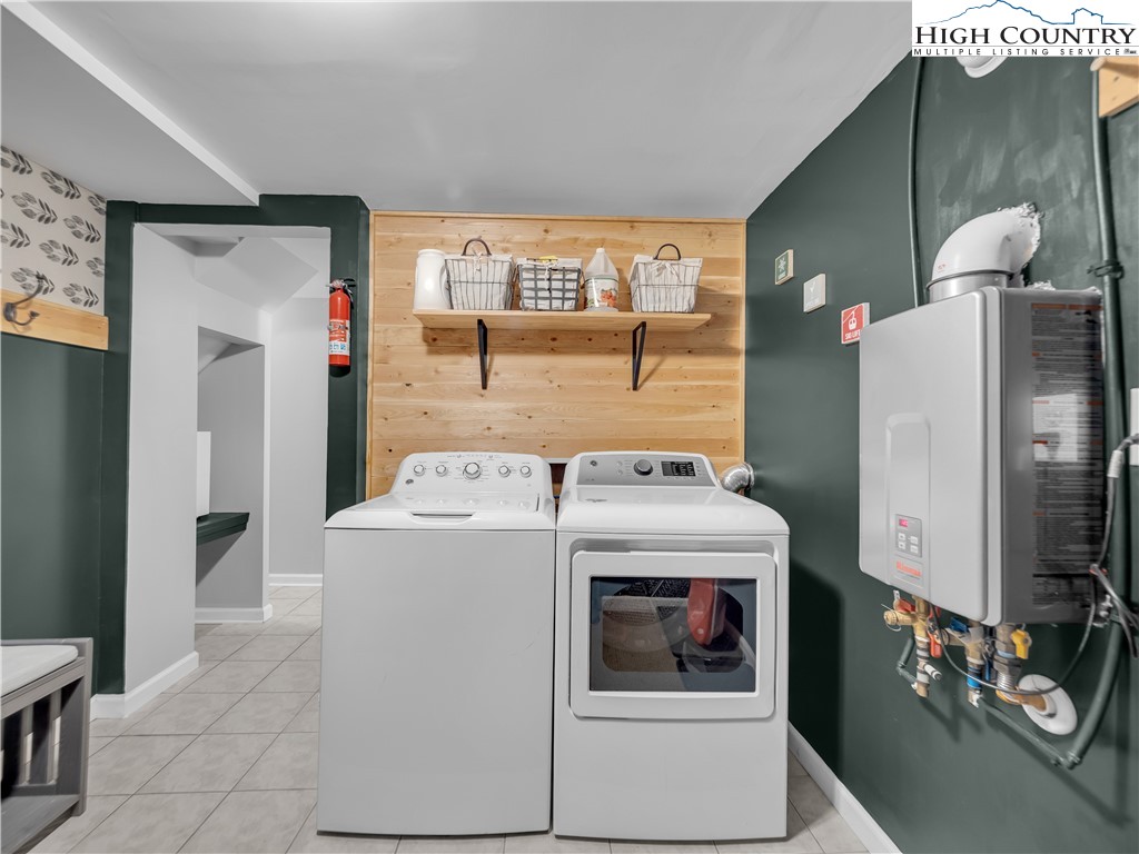 404 Charter Hills Road Beech Mountain, NC 28604 - Photo 26 of 36 a utility room with dryer and washer