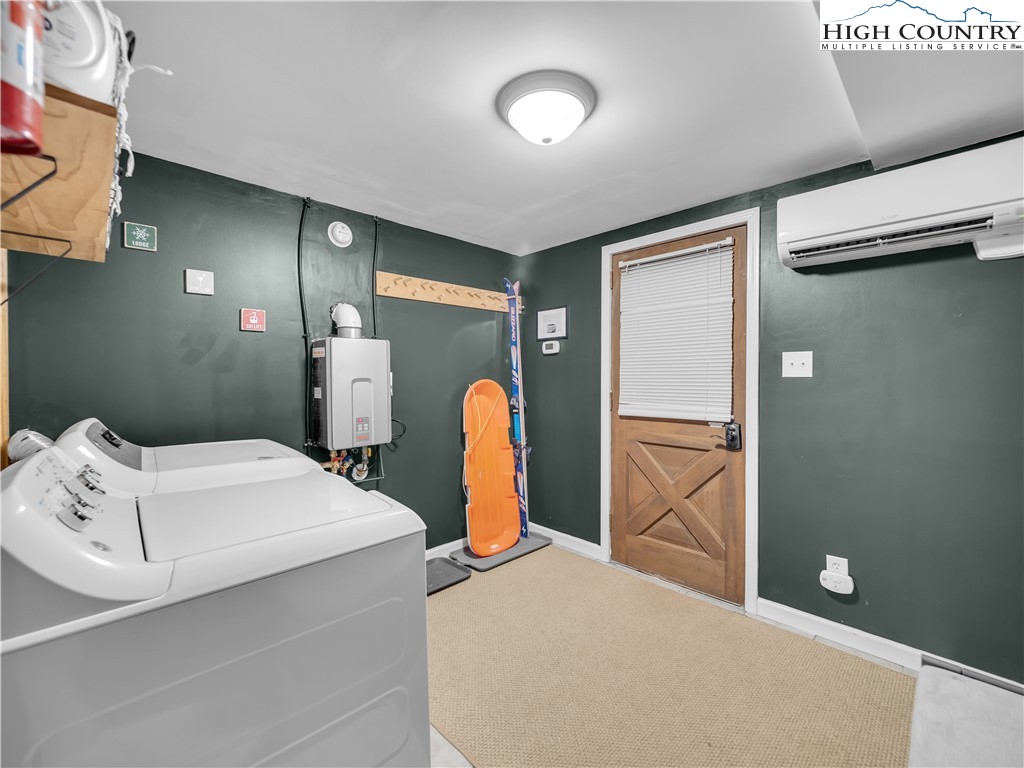 404 Charter Hills Road Beech Mountain, NC 28604 - Photo 27 of 36 a bedroom with a bed and a refrigerator