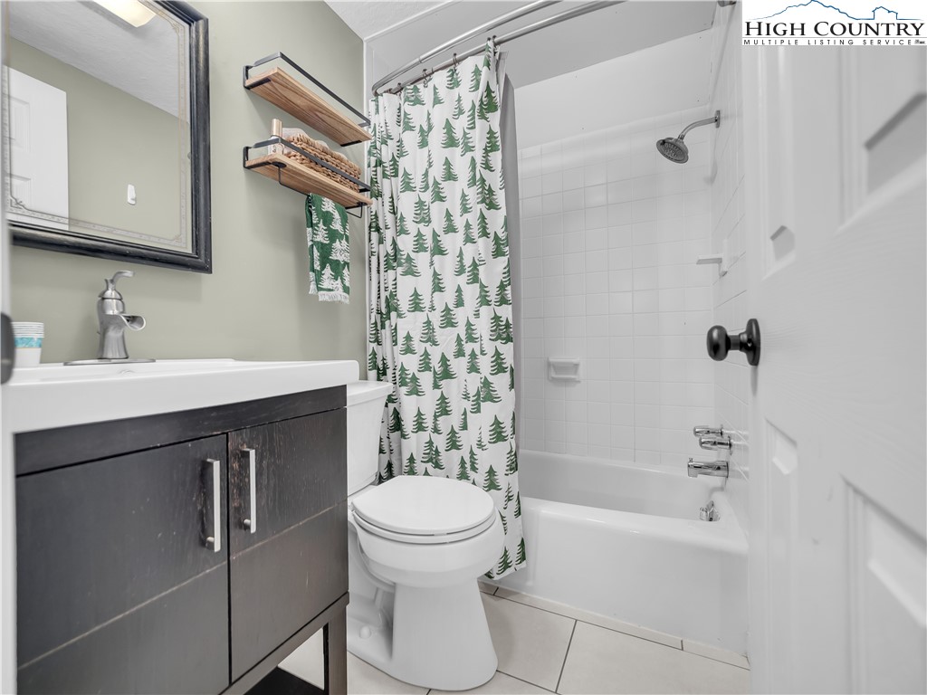 404 Charter Hills Road Beech Mountain, NC 28604 - Photo 29 of 36 a bathroom with a sink toilet and shower