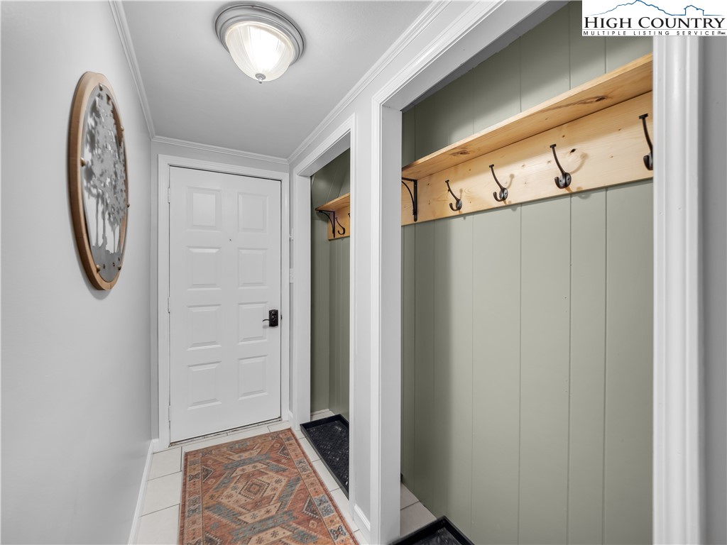 404 Charter Hills Road Beech Mountain, NC 28604 - Photo 34 of 36 a bathroom with a granite countertop sink and a mirror